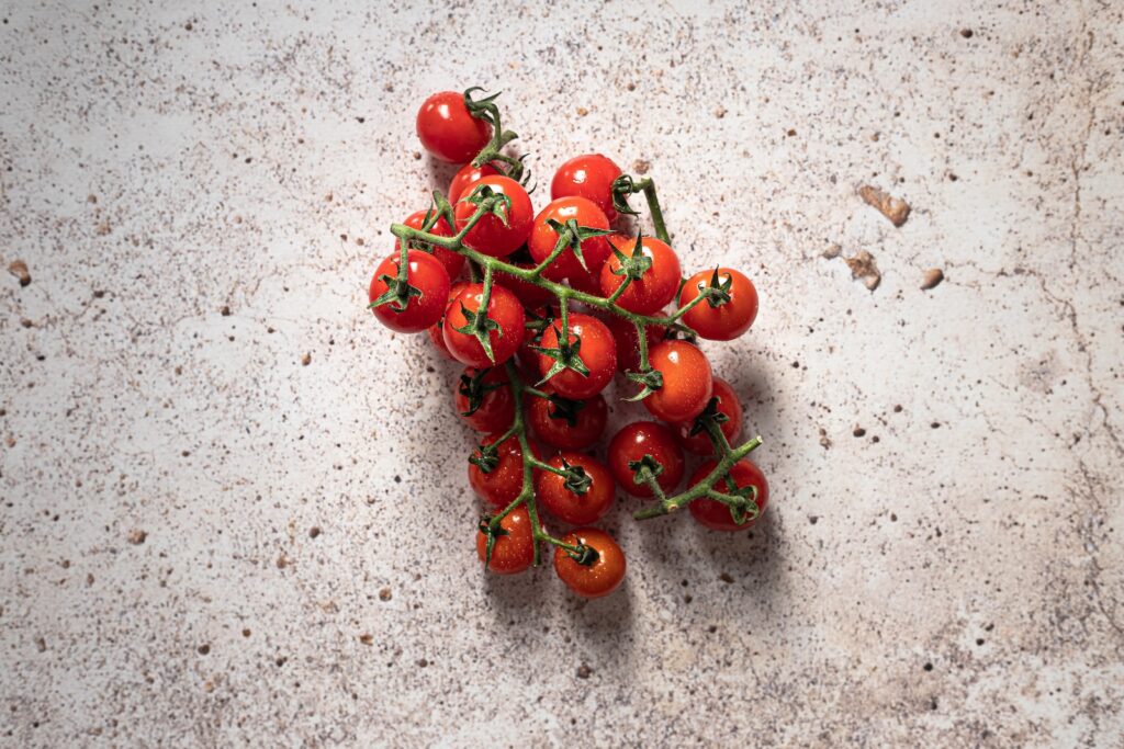 Red cherries on white sand