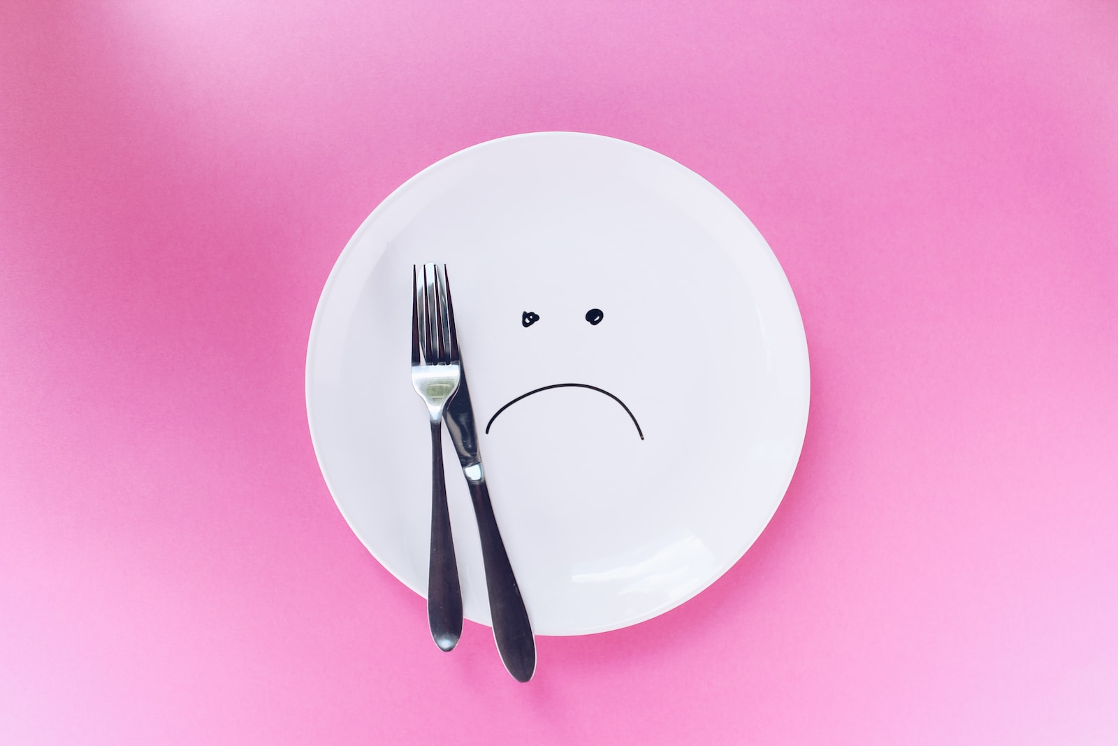 Silver fork and knife on plate