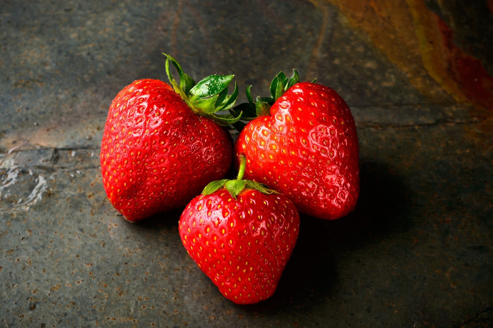 Three red strawberries