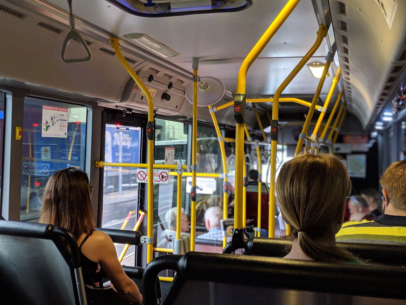 People sitting down inside vehicle