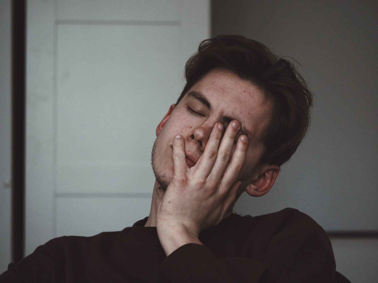 Man wearing black crew neck top