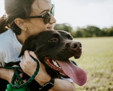 woman hugging a dog