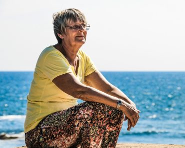 woman sitting on seashore