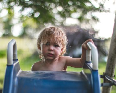 children climbing on slide