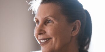 Close-Up Shot of an Elderly Woman Smiling