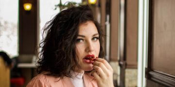 woman sitting on black chair