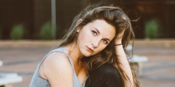 woman sitting on picnic table