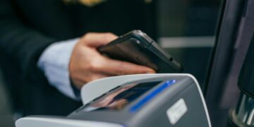 shallow focus photography of person holding smartphone