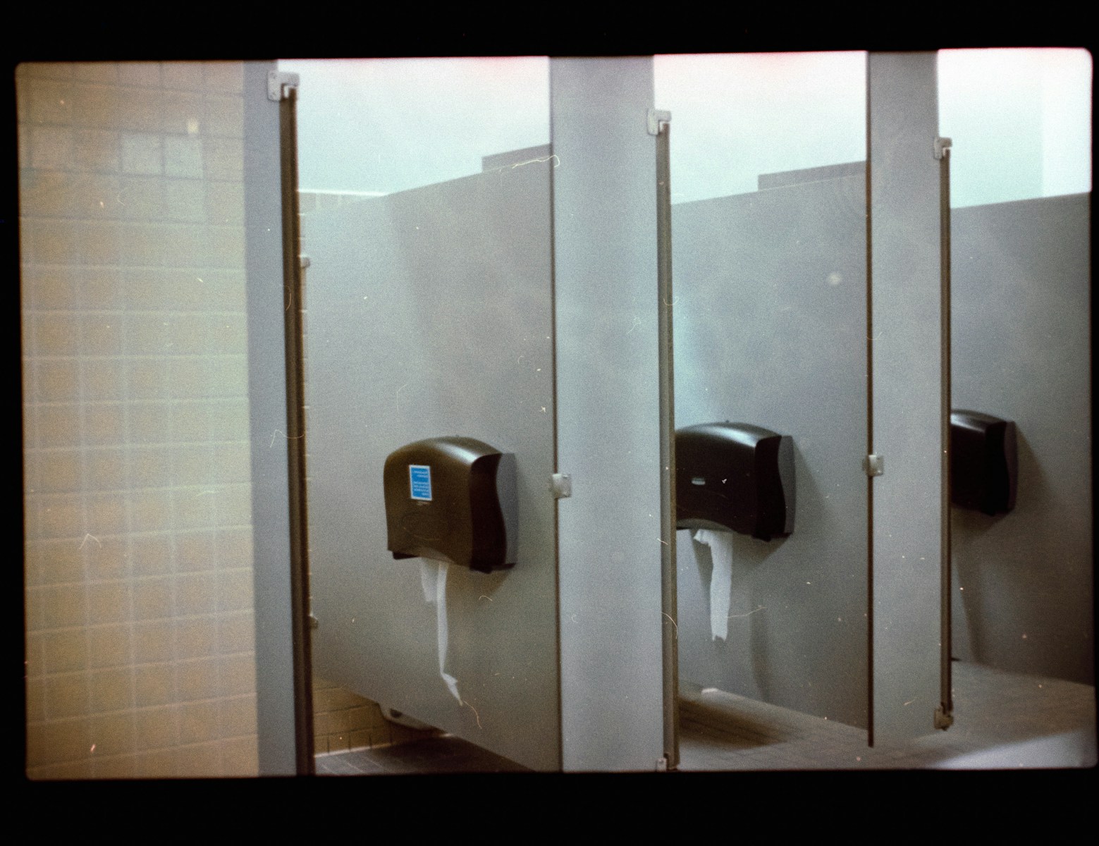 A row of urinals in a public restroom