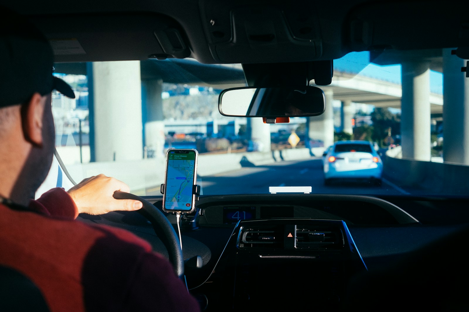 Person holding iphone 6 inside car