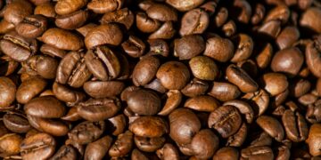 brown coffee beans on brown wooden table