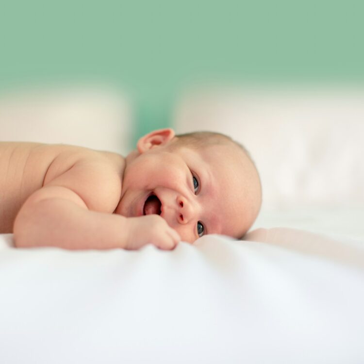 Baby lying on fabric cloth