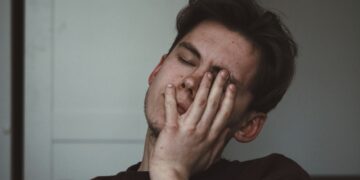man wearing black crew-neck top