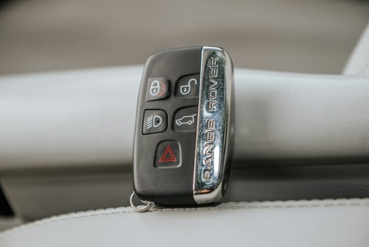 A close up of a remote control on a car