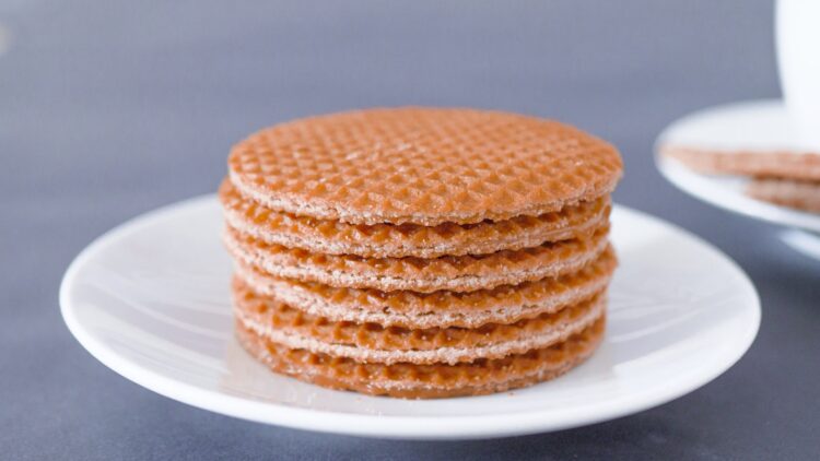 Brown round cookies on white ceramic plate