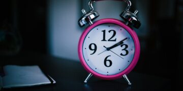 pink bell alarm clock showing 2:10