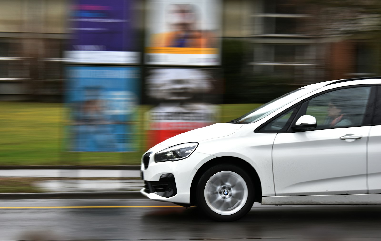 White car on road during daytime