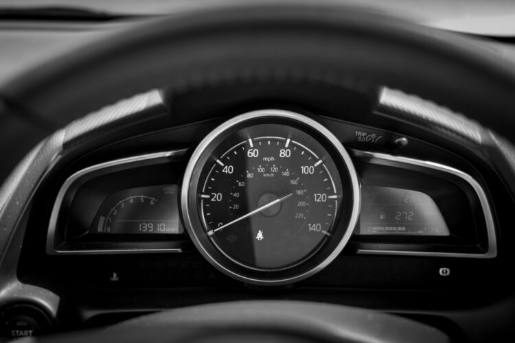 Black and white car speedometer