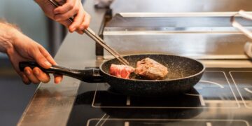 unknown person frying meat
