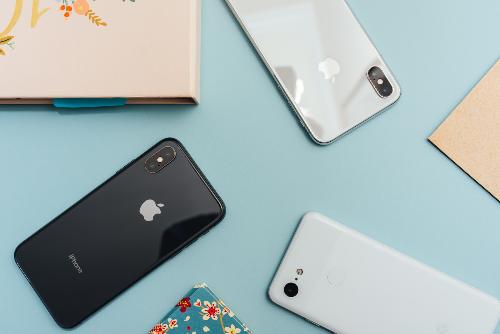 Space gray iphone x on blue surface