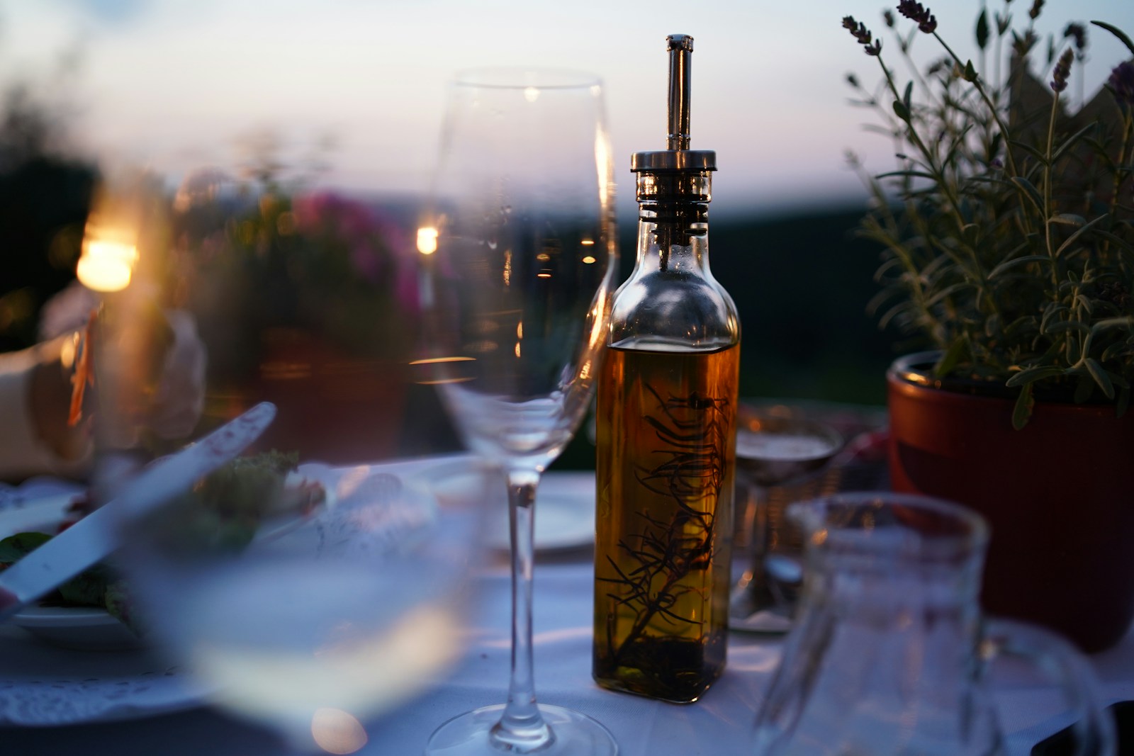 Printed bottle near clear glass wine cup close up photography