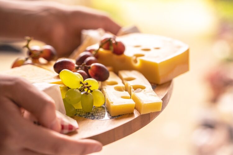 Cheese platter food snack grapes cheese cheese plate cheese board fruit gouda swiss cheese dairy product semi hard cheese soft cheese healthy tasty delicious closeup cheese cheese cheese cheese cheese