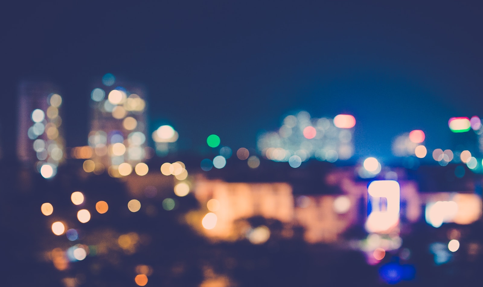 A blurry photo of a city at night