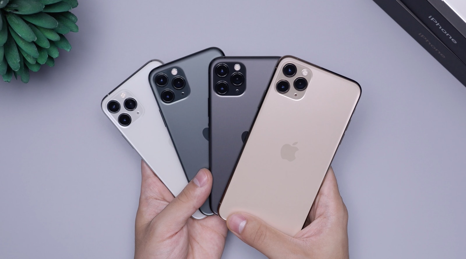 Two space gray and two silver iphone 11's