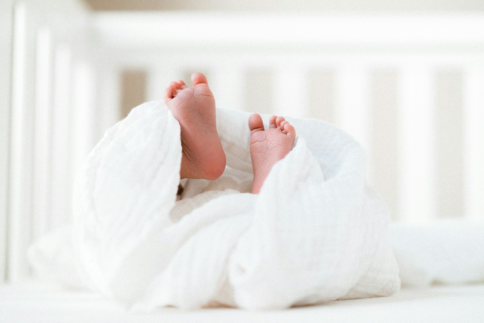 Person covered with white blanket