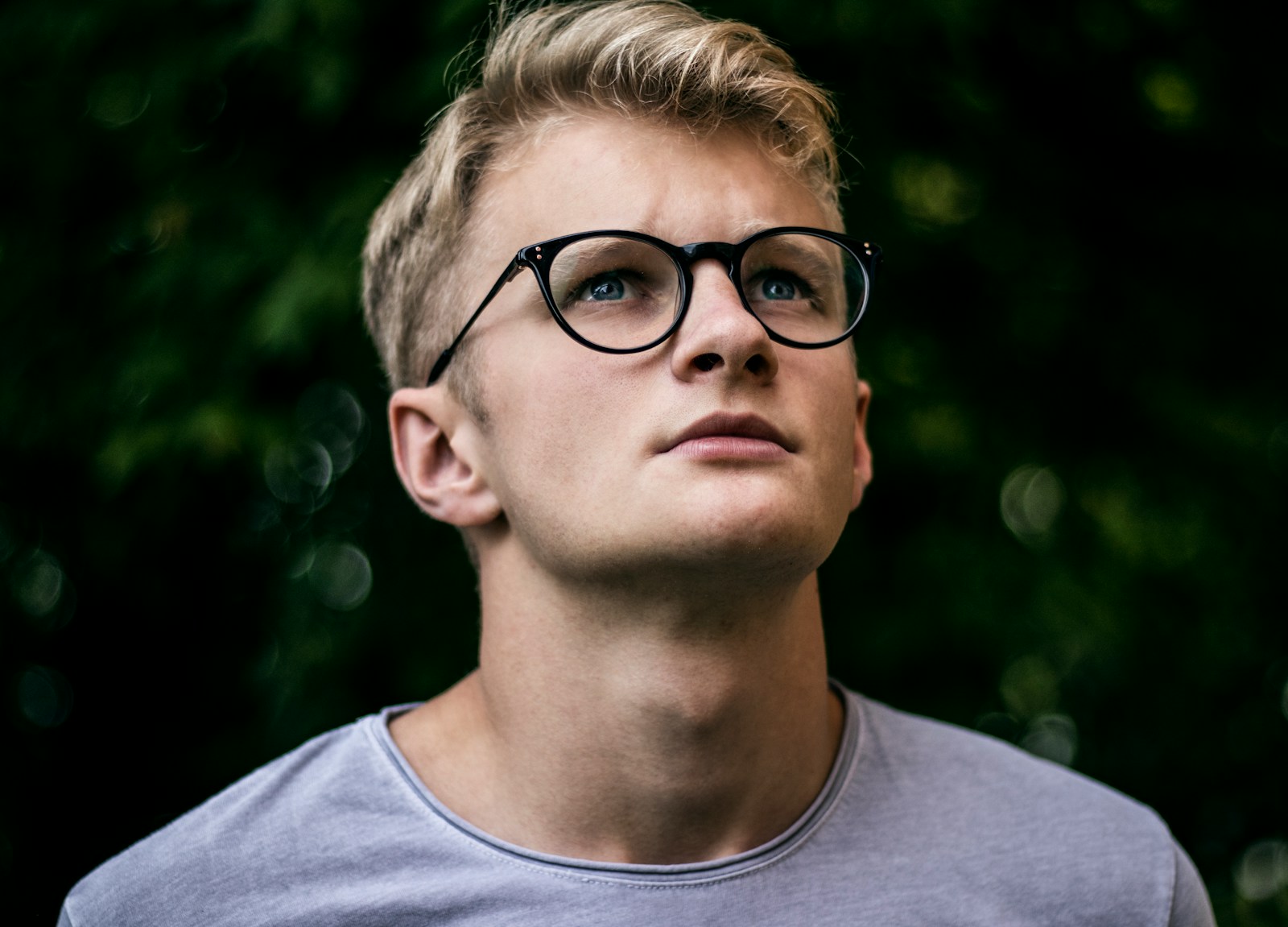 Selective focus photography of man wearing eyeglasses