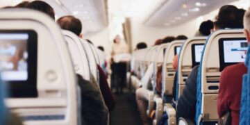 shallow focus photography of people inside of passenger plane