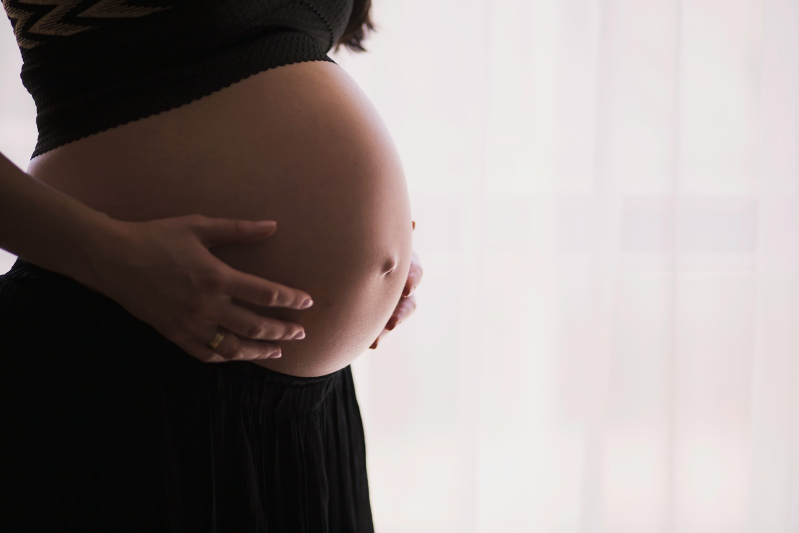 Woman holding stomach