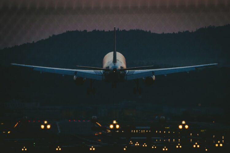 White airplane in the sky during night time