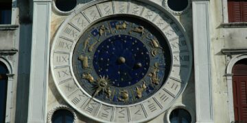 a large clock on the side of a building