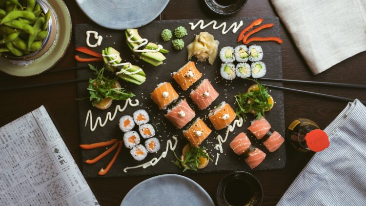 Sushi on black ceramic plate