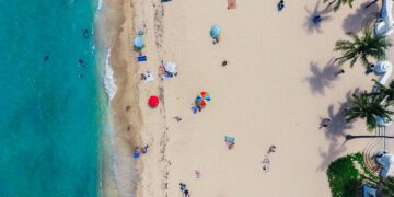 aerial photography of people gathering on shore