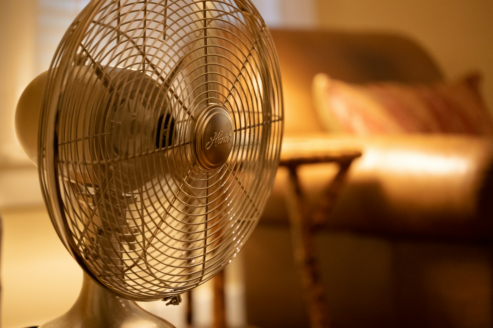 White stand fan turned on in room