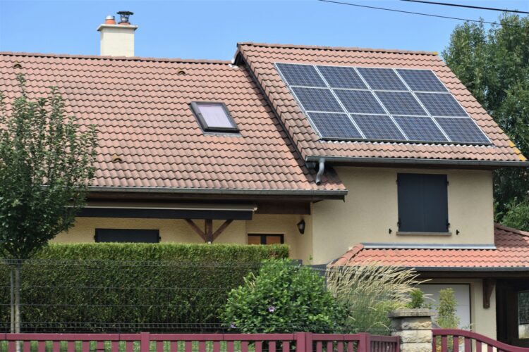 A house with a solar panel on the roof