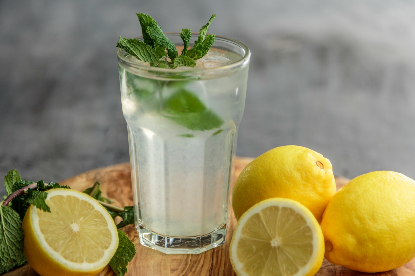 Lime juice on drinking glass beside sliced limes