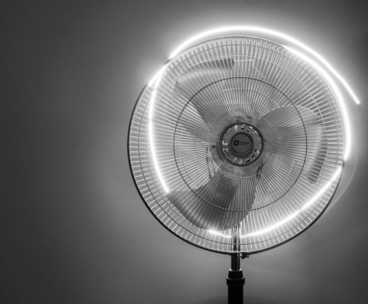 A large fan with a light