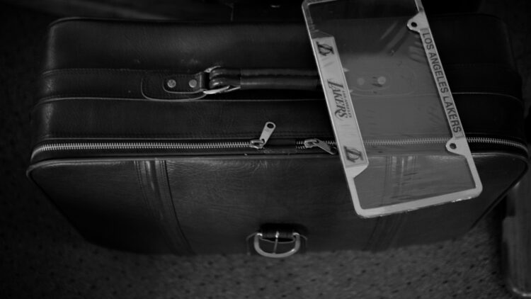 A black wallet with a note