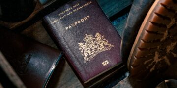 black leather bifold wallet on black leather textile