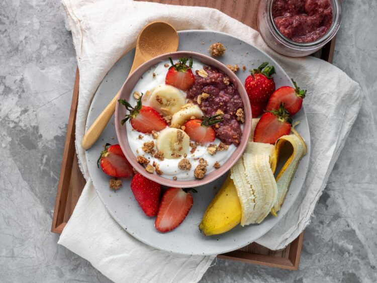 Sliced fruits on white ceramic plate