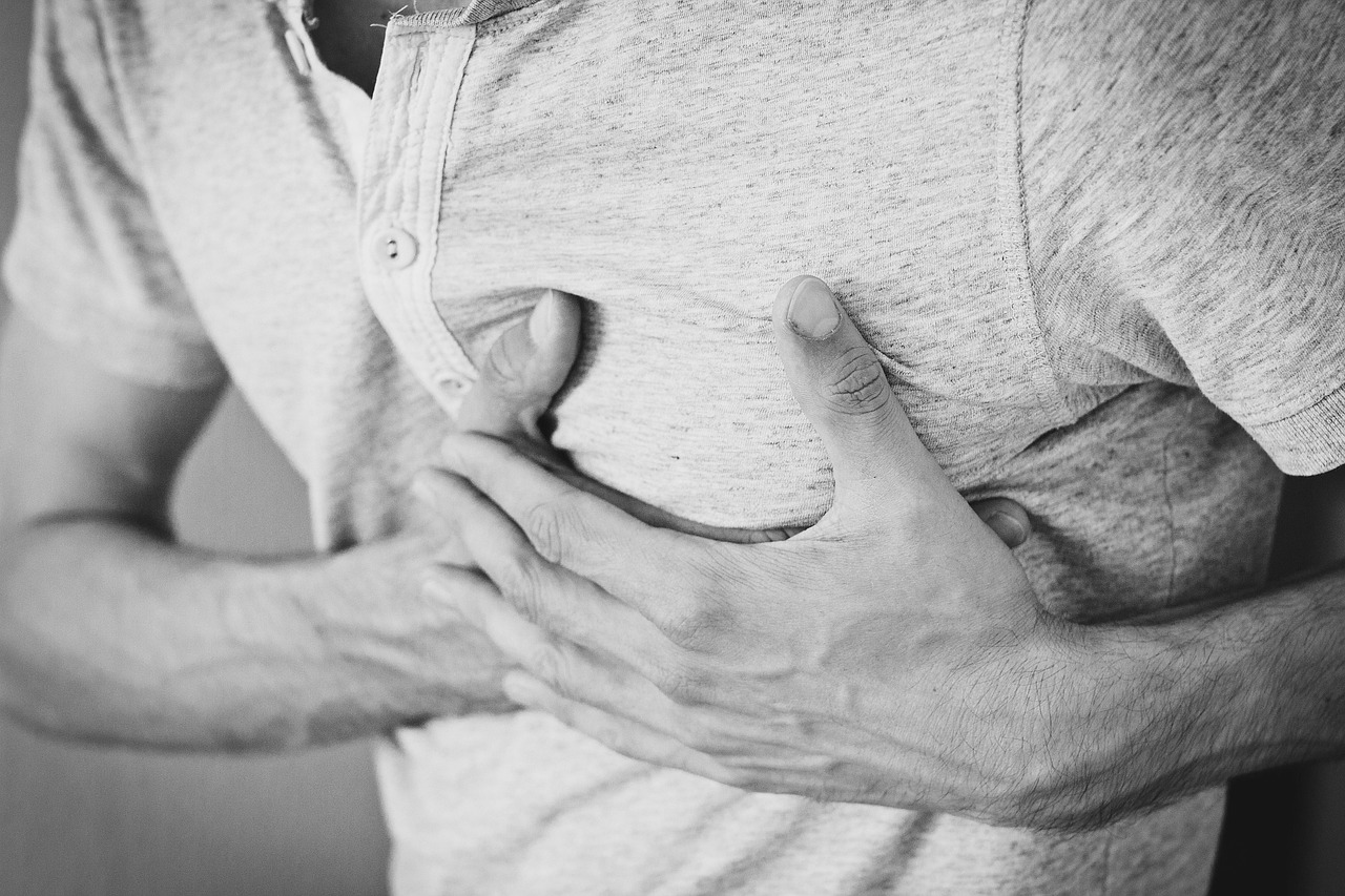 Man heartache chest pain hurt pain heart attack adult chest cotton shirt hands ouch monochrome black and white heart attack heart attack heart attack heart attack heart attack