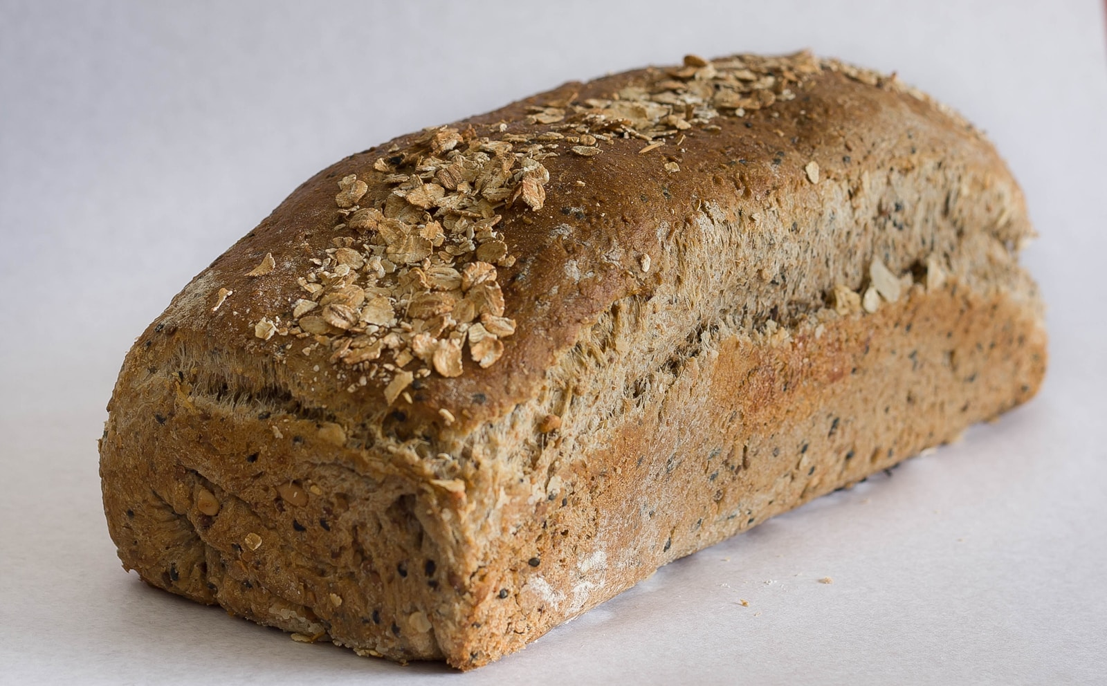 Baked loft bread on white surface