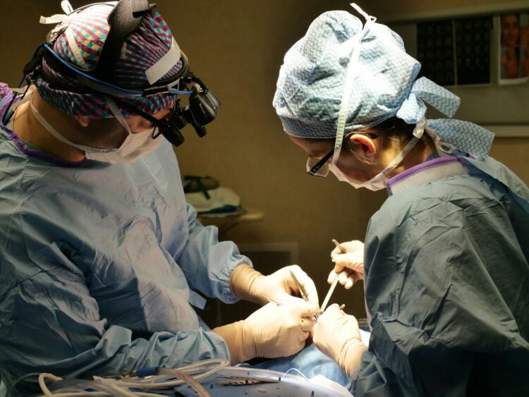 Surgeons performing a medical procedure in an operating room