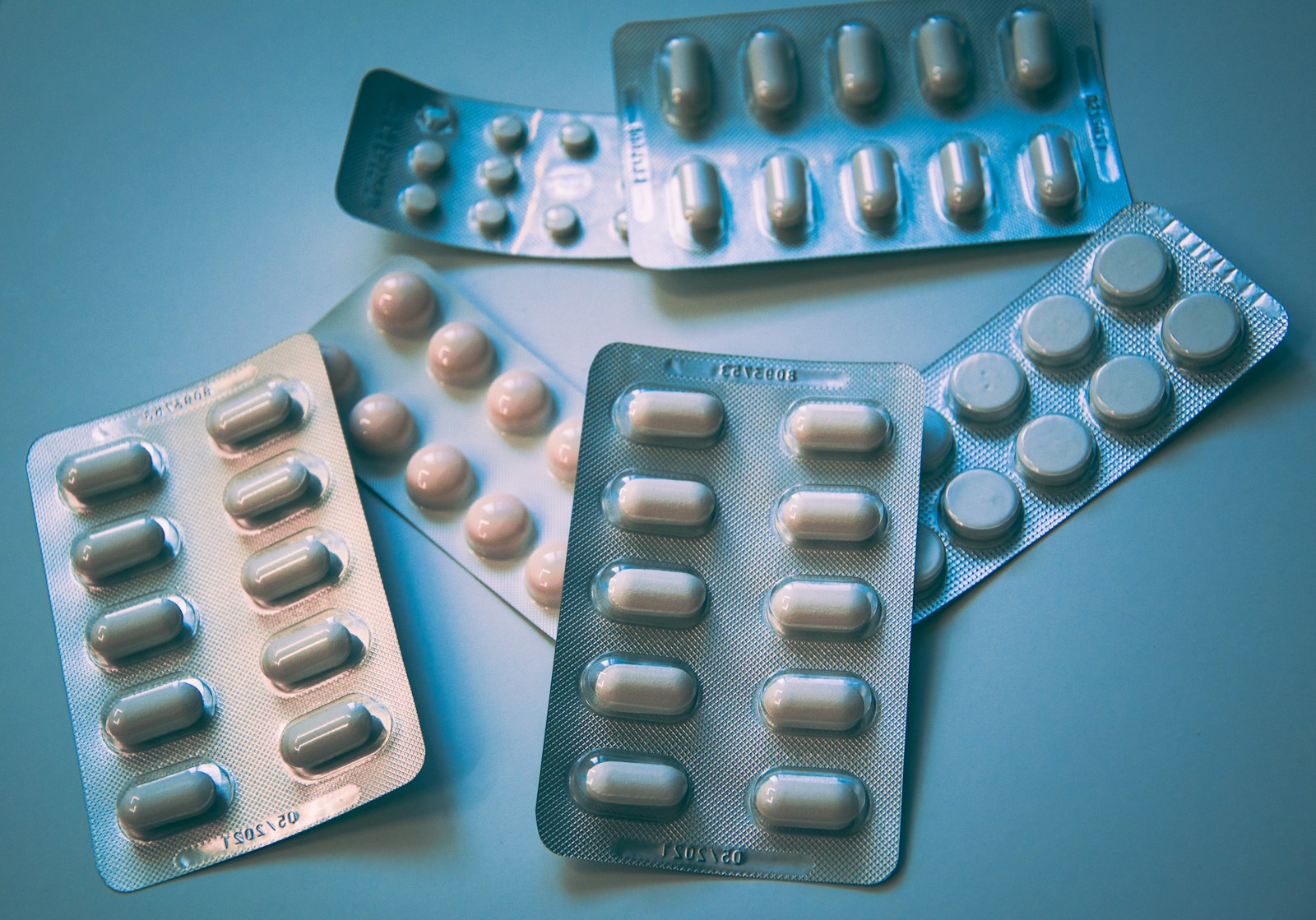 White and blue medication pill blister pack