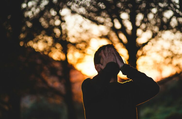 Man wearing black long sleeved shirt