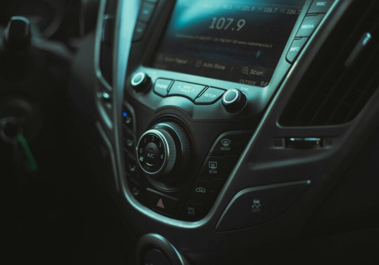 Detailed image of a car's dashboard with visible controls and air vent