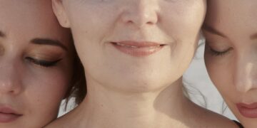 two women with their eyes closed and their eyes closed